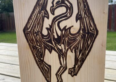 A large pyrography piece of the dragon from Skyrim